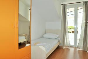 Posteľ alebo postele v izbe v ubytovaní Apartments Sandy Beach