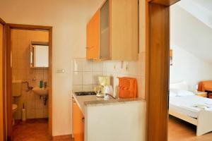 Posteľ alebo postele v izbe v ubytovaní Apartments Sandy Beach