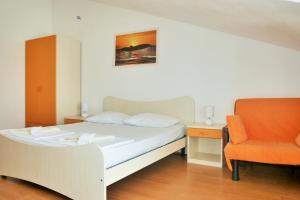 Posteľ alebo postele v izbe v ubytovaní Apartments Sandy Beach