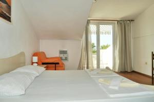 Posteľ alebo postele v izbe v ubytovaní Apartments Sandy Beach