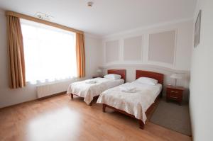Posteľ alebo postele v izbe v ubytovaní Hotel Nest