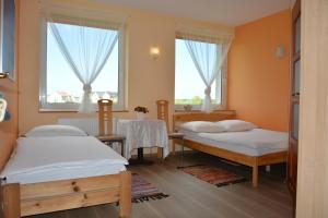 Łóżko lub łóżka w pokoju w obiekcie Słoneczny Dom pokoje i apartament na wynajem