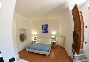 a bedroom with a bed in a room with a staircase at B&B Costa di Amalfi in Vietri sul Mare