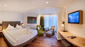 Postel nebo postele na pokoji v ubytování Hotel Villa Hügel
