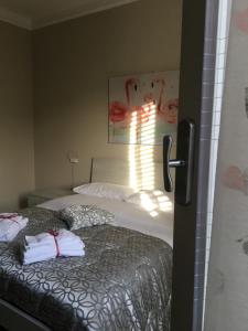 Postel nebo postele na pokoji v ubytování B&B Amores