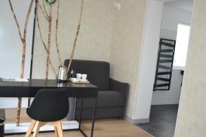 Posezení v ubytování Logis Auberge de Pont Calleck
