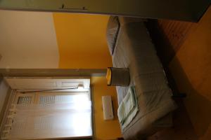 ajar view of a bunk bed in a room at CSI Coimbra & Guest House - Student accommodation in Coimbra