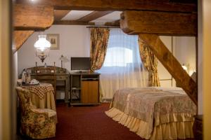 Un pat sau paturi într-o cameră la Hotel Gutenbergs