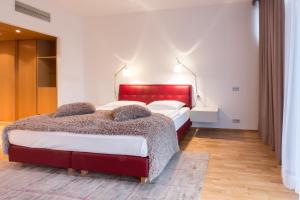 Postel nebo postele na pokoji v ubytování Das Sonnreich - Thermenhotel Loipersdorf