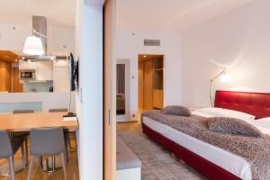 Postel nebo postele na pokoji v ubytování Das Sonnreich - Thermenhotel Loipersdorf