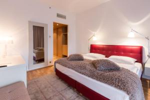 Postel nebo postele na pokoji v ubytování Das Sonnreich - Thermenhotel Loipersdorf