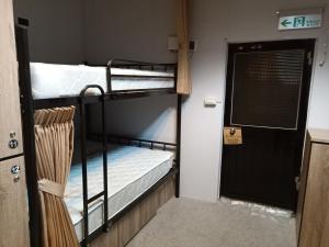 Postel nebo postele na pokoji v ubytování Yes, Sir Homestay 2