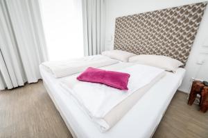 Łóżko lub łóżka w pokoju w obiekcie Alpenrock Schladming by ALPS RESORTS