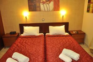 Postel nebo postele na pokoji v ubytování Corfu Studios Stavroula - San George Apartments