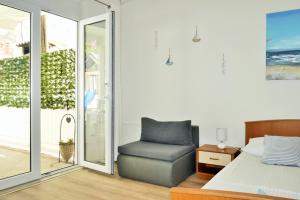 Posteľ alebo postele v izbe v ubytovaní Apartments Sandy Beach