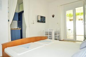 Posteľ alebo postele v izbe v ubytovaní Apartments Sandy Beach