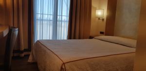 Posteľ alebo postele v izbe v ubytovaní Hotel Tiffany Milano