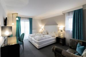 Ένα ή περισσότερα κρεβάτια σε δωμάτιο στο Hotel Villa Groff