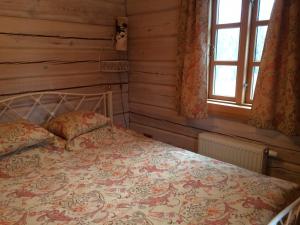 Posteľ alebo postele v izbe v ubytovaní Baublys Lake Lodge