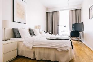 Llit o llits en una habitació de Pietarsaaren Kaupunginhotelli