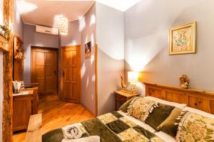 Posteľ alebo postele v izbe v ubytovaní Aparthotel Oberża