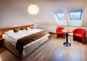 Postel nebo postele na pokoji v ubytování Hotel Bešeňová