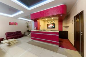 a lobby with a bar in the middle of a room at Hotel Nivki in Kyiv
