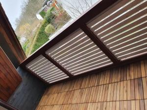a roller shutter window on a wooden building at Ferienwohnung Steiner 2 in Homburg