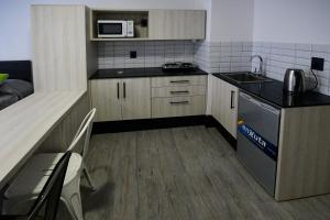 Kuchyň nebo kuchyňský kout v ubytování Quijano Hotel - Aparts & Suites