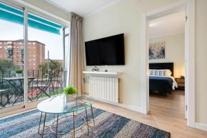 Televízia a/alebo spoločenská miestnosť v ubytovaní Tendency Apartments Forum 4