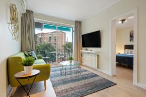 Televízia a/alebo spoločenská miestnosť v ubytovaní Tendency Apartments Forum 4