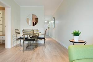 a dining room with a table and chairs at Tendency Apartments Forum 4 in Barcelona
