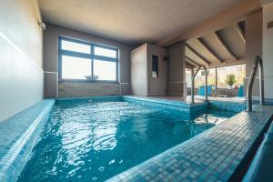 a swimming pool in a house at Mansarda Relax Wellness Gym & Spa in Taormina