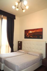Postel nebo postele na pokoji v ubytování Hotel Ester