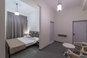 Postel nebo postele na pokoji v ubytování Hotel Opinion