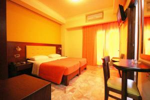 Postel nebo postele na pokoji v ubytování Hotel Filoxenia