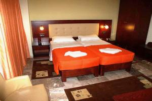 Postel nebo postele na pokoji v ubytování Hotel Filoxenia