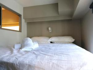 The Loft at Midhills Genting Highlands Free WiFi客房内的一张或多张床位