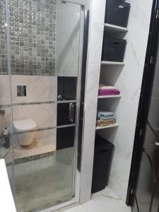 a bathroom with a shower and a toilet at Sweet home in Kenitra