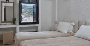 Кровать или кровати в номере Mare Vista Hotel - Epaminondas