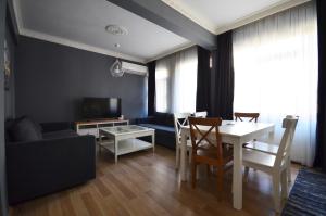 a living room with a table and a couch at Two Minutes To Galata Tower in Istanbul