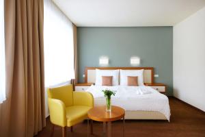 Postel nebo postele na pokoji v ubytování Hotel Radun