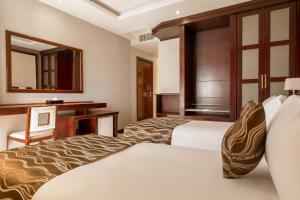 Tempat tidur dalam kamar di Best Western Plus Pearl Addis
