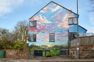 a mural on the side of a building at The Mural - City Centre - Your Apartment in Bristol