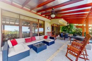a living room with a couch and a table at Bahia Pez Vela Villa in Ocotal