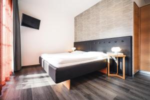 Postel nebo postele na pokoji v ubytování Hotel Birkenhof