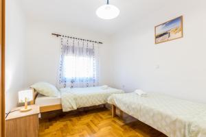 Postel nebo postele na pokoji v ubytování Relaxing apartment Josip - peaceful area