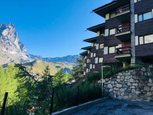 a building on the side of a mountain at Panoramic Apartment in Breuil-Cervinia