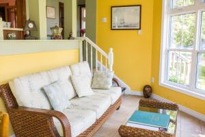 a living room with a couch and a table at The Harbour House in Charlottetown