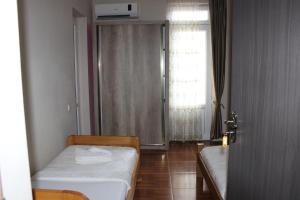 Voodi või voodid majutusasutuse Tornado Hotel toas